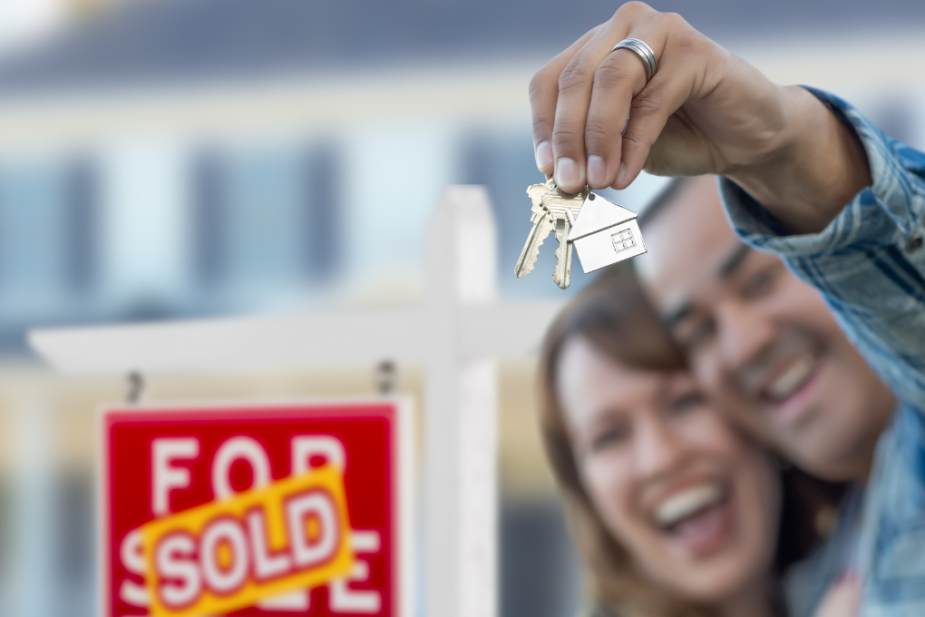 First home buyers celebrating after purchasing their home through the Home Guarantee Scheme with a 5% deposit